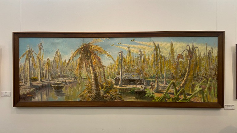 Bức tranh "Chất độc màu da cam" của cố họa sĩ Lê Lam được giới thiệu tại triển lãm. (Ảnh: HUY LÊ)