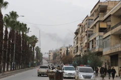 Lực lượng an ninh Syria tuần tra trên đường phố Aleppo. THX/TTXVN