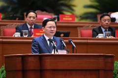 Phó Trưởng Ban Chính sách, chiến lược Trung ương Nguyễn Anh Tuấn trình bày tham luận tại Đại hội đại biểu toàn quốc lần thứ XIV của Đảng.