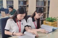 Sinh viên Trường đại học Luật Thành phố Hồ Chí Minh đang học tập tại thư viện.