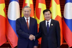 Tổng Bí thư Tô Lâm và Tổng Bí thư, Chủ tịch nước Lào Thongloun Sisoulith đồng chủ trì Cuộc gặp cấp cao giữa Đảng Cộng sản Việt Nam và Đảng Nhân dân Cách mạng Lào. (Ảnh: Thống Nhất/ TTXVN)
