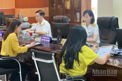 Từ ngày 1/1/2026, người nộp thuế chính thức không phải nộp và không phải kê khai lệ phí môn bài. (Ảnh: MINH PHƯƠNG)