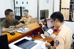 Bộ Tài chính chính thức áp dụng mức thu mới đối với lệ phí đăng ký, cấp biển số phương tiện giao thông cơ giới đường bộ từ 1/7/2025. (Ảnh: BÁO NHÂN DÂN)