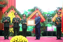 Tổng Bí thư Tô Lâm trao danh hiệu Anh hùng lực lượng vũ trang nhân dân tặng Tổng cục Hậu cần-Kỹ thuật (Bộ Quốc phòng). (Ảnh: ĐĂNG KHOA)
