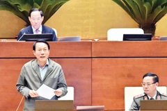Bộ trưởng Công an Lương Tam Quang phát biểu giải trình, làm rõ một số vấn đề đại biểu Quốc hội nêu. (Ảnh ĐĂNG ANH)