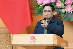 Thủ tướng Chính phủ Phạm Minh Chính phát biểu ý kiến chỉ đạo tại cuộc họp khẩn bàn giải pháp khắc phục hậu quả mưa lũ lịch sử ở miền trung. (Ảnh: TRẦN HẢI)