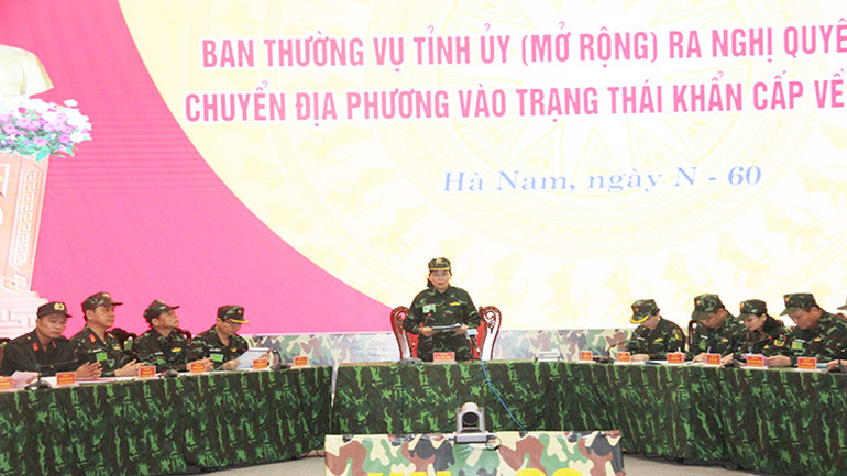 Diễn tập vận hành cơ chế: Hội nghị Ban Thường vụ Tỉnh ủy (mở rộng) ra Nghị quyết chuyển địa phương vào trạng thái khẩn cấp về quốc phòng. Diễn tập vận hành cơ chế: Hội nghị Ban Thường vụ Tỉnh ủy (mở rộng) ra Nghị quyết chuyển địa phương vào trạng thái khẩn cấp về quốc phòng.