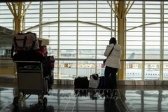 Hành khách tại sân bay quốc gia Ronald Reagan Washington ở Arlington, Virginia, Mỹ. (Ảnh minh họa: THX/TTXVN)