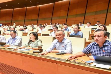 Các đại biểu Quốc hội bấm nút biểu quyết Quốc hội đã biểu quyết thông qua Luật sửa đổi, bổ sung một số điều của Luật Tiêu chuẩn và Quy chuẩn kỹ thuật năm 2025.