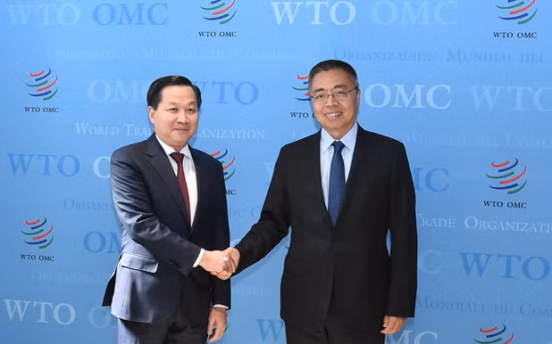 Phó Thủ tướng Chính phủ Lê Minh Khái và Phó Tổng Giám đốc WTO Trương Hướng Thần. (Ảnh: VGP)