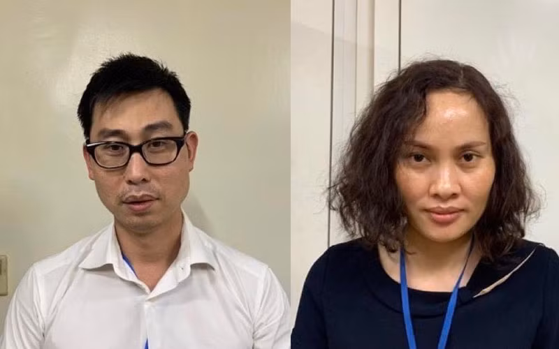 Bị can Phạm Đức Tuấn (nam áo trắng) và bị can Ngô Thị Thu Huyền (nữ áo xanh đen) (Ảnh: Bộ Công an).