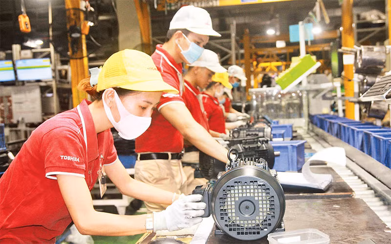 Sản xuất động cơ điện tại Công ty TNHH Sản phẩm công nghiệp Toshiba Asia, Khu công nghiệp Amata (Ðồng Nai). Ảnh: THIÊN VƯƠNG