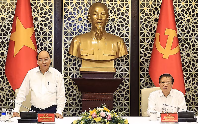 Chủ tịch nước Nguyễn Xuân Phúc phát biểu ý kiến tại buổi làm việc. (Ảnh TTXVN)