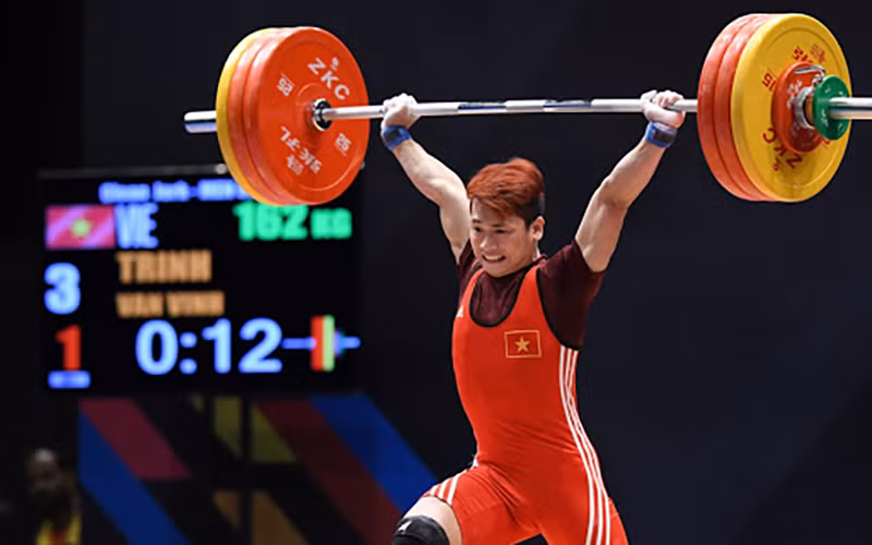 VĐV Trịnh Văn Vinh từng vô địch cử tạ thế giới hạng cân 62 kg bị cấm thi đấu bốn năm do sử dụng đô-pinh. Ảnh:TIẾN TUẤN
