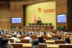 Quốc hội biểu quyết thông qua Luật sửa đổi, bổ sung một số điều của Luật Phòng, chống tham nhũng. (Ảnh: DUY LINH)