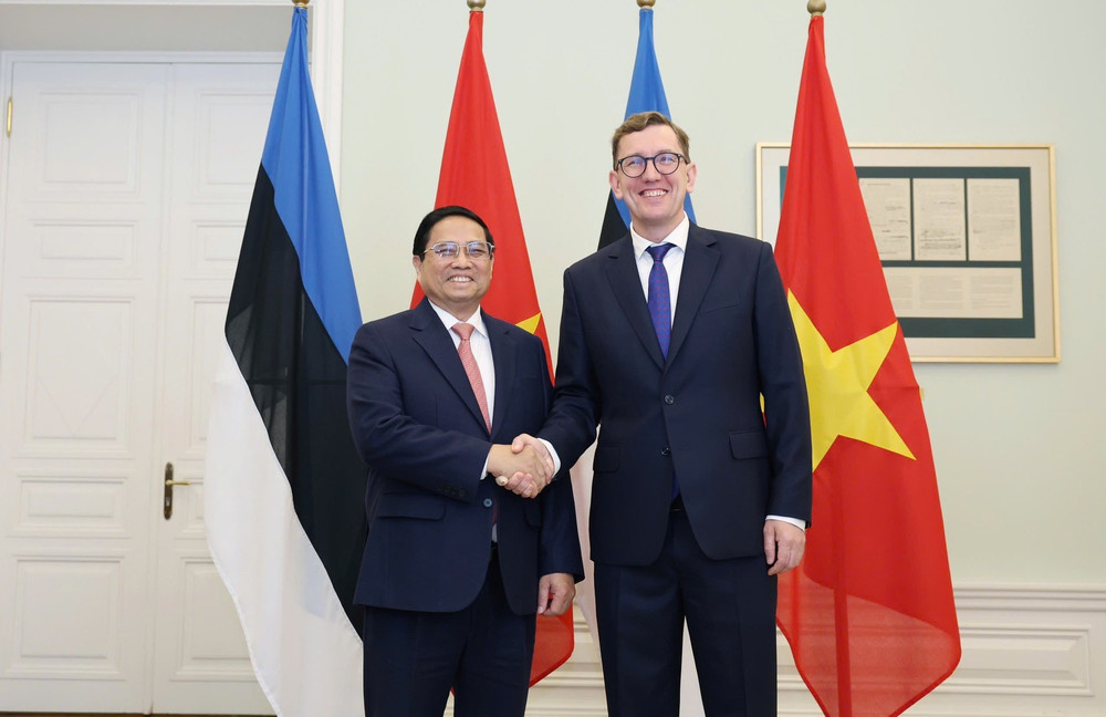 Thủ tướng Chính phủ Phạm Minh Chính và Thủ tướng Estonia Kristen Michal (Ảnh: Dương Giang/TTXVN).