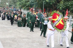 Lễ truy điệu và an táng hài cốt liệt sĩ tại Nghĩa trang Liệt sĩ Vị Xuyên.
