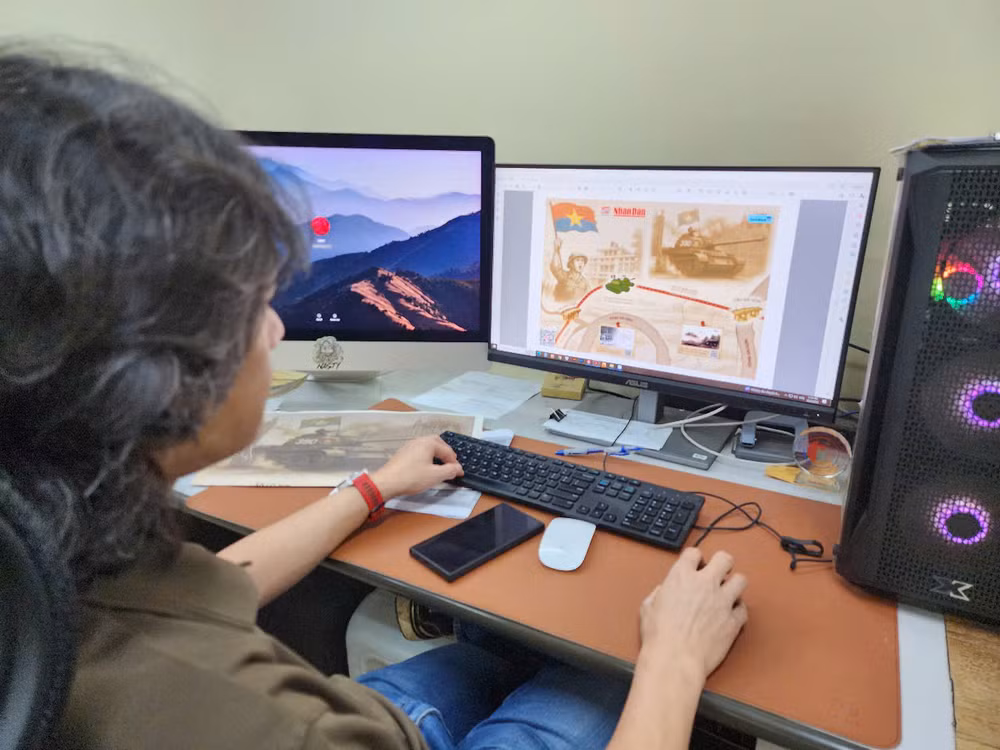 Nhân viên chế bản nhà in Báo Nhân Dân xử lý file cho ấn phẩm phụ san đặc biệt kỷ niệm 50 năm Ngày Giải phóng miền nam, thống nhất đất nước