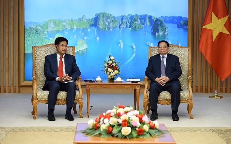 Thủ tướng Phạm Minh Chính tiếp Bộ trưởng Bộ Tư pháp Lào Phayvy Siboualypha. (Ảnh: Thanh Hải)
