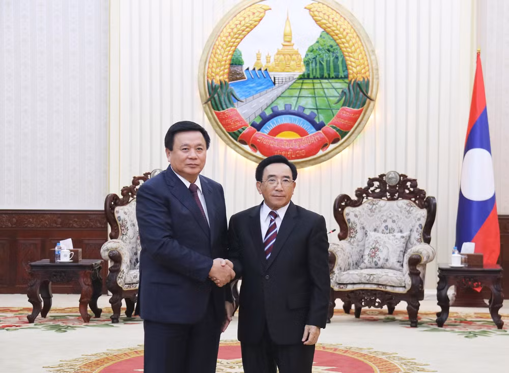 Đồng chí Nguyễn Xuân Thắng tiếp kiến Thủ tướng Chính phủ Lào Phankham Viphavanh. (Ảnh: TRỊNH DŨNG)