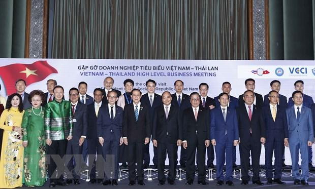 Chủ tịch nước Nguyễn Xuân Phúc với các doanh nghiệp tiêu biểu Việt Nam-Thái Lan. (Ảnh: TTXVN) 
