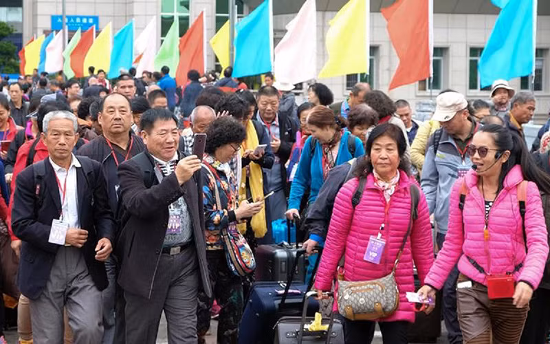 Du khách Trung Quốc nhập cảnh vào Việt Nam qua cửa khẩu Móng Cái (Quảng Ninh) thời điểm trước dịch. (Ảnh HOÀI NAM) 