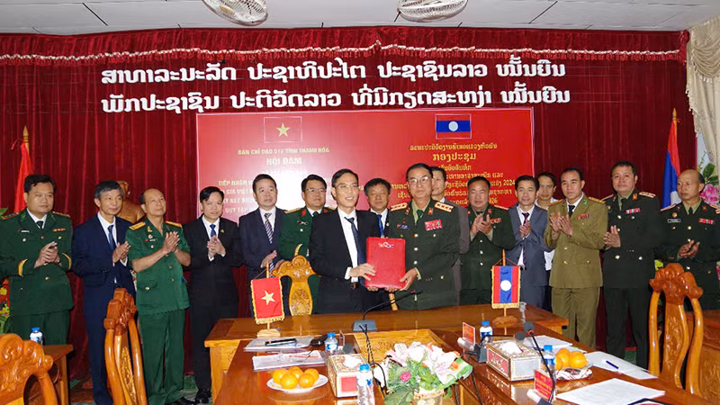 Quang cảnh lễ ký kết phối hợp tìm kiếm, quy tập liệt sĩ.