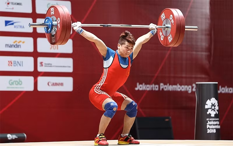 Vận động viên cử tạ Trịnh Văn Vinh được kỳ vọng giành huy chương tại Olympic Paris 2024. (Ảnh DT)