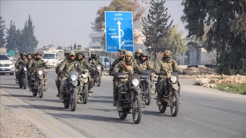 Các lực lượng đối lập tại khu vực thành phố Homs (Syria). (Ảnh: AA/TTXVN)