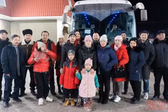 Công dân Việt Nam sơ tán từ Kherson (Ukraine) sang LB Nga. (Ảnh: Thanh Thể)