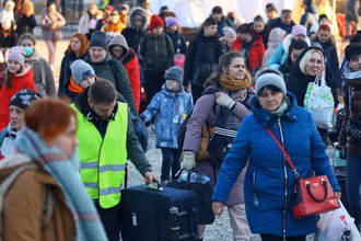 Người tị nạn Ukraine tại 1 trạm kiểm soát biên giới ở Kroscienko, Ba Lan, ngày 17/3/2022. (Ảnh: REUTERS)