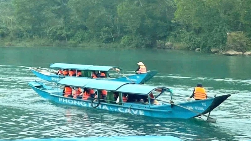 Visitors exploring Phong Nha Cave.