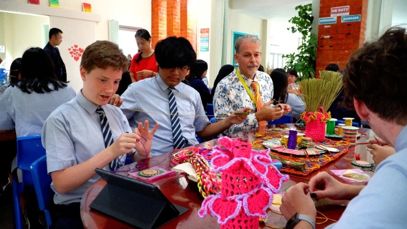 Students from grades 7 to 12, representing various nationalities, have the opportunity to experience Viet Nam's traditional hand embroidery techniques.