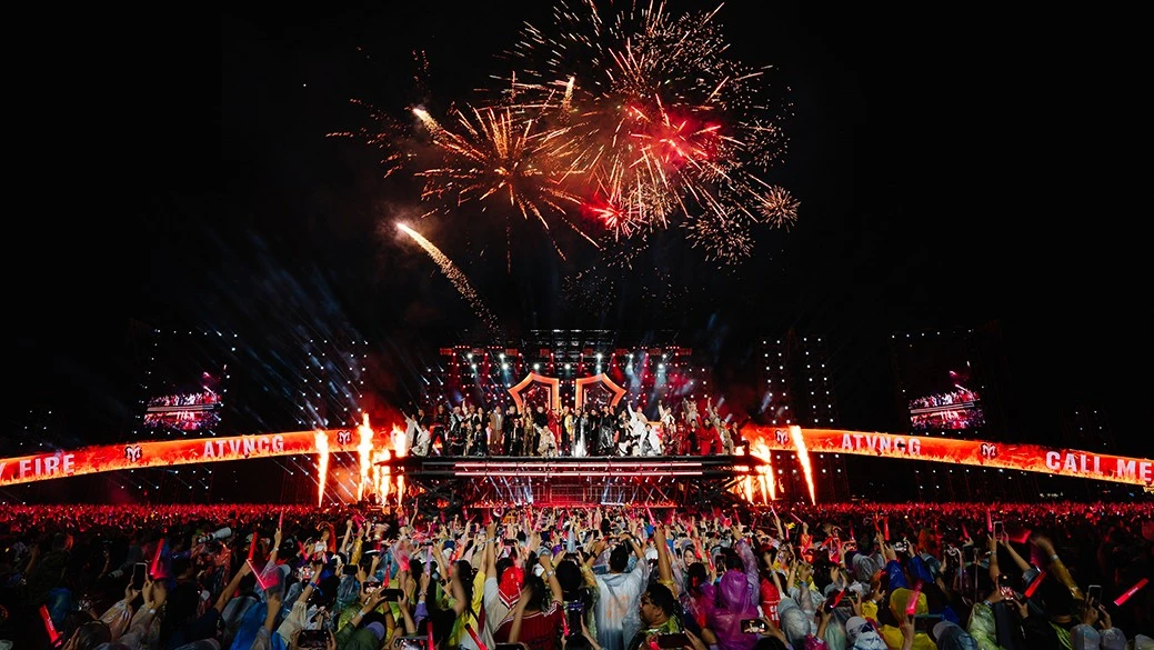Grand scale concert tour stadium live performance under massive firework displays