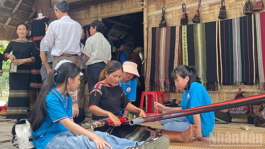 Visitors explore traditional weaving of the Central Highlands ethnic communities at the Village.