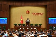 Quốc hội biểu quyết thông qua Bộ luật Tố tụng hình sự. (Ảnh: DUY LINH)