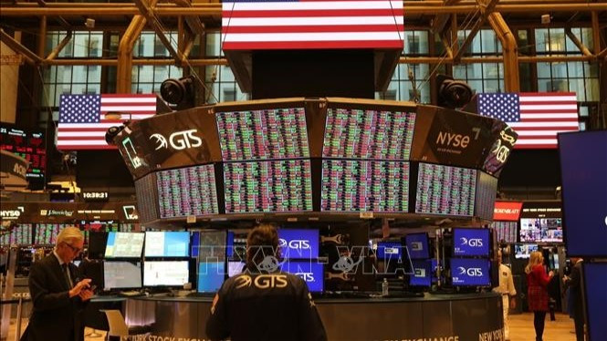 Giao dịch viên tại Sàn chứng khoán New York, Mỹ. (Ảnh: THX/TTXVN)