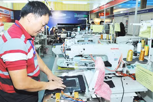 Doanh nghiệp phải chủ động đầu tư công nghệ, đẩy mạnh tự động hóa nhằm tăng năng suất, bù đắp chi phí lao động tăng thêm. Ảnh: NAM ANH