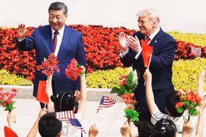 Hai nhà lãnh đạo Trung Quốc (bên trái) và Mỹ gặp gỡ tại Bắc Kinh. Ảnh: BBC