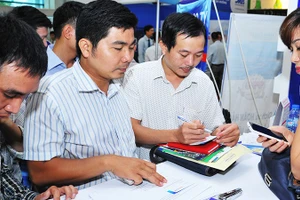 Cho vay mua bất động sản chiếm tỷ lệ cao trong hoạt động tín dụng. Ảnh: NGUYỆT ANH