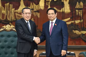 Thủ tướng Chính phủ Phạm Minh Chính và Bộ trưởng Bộ Lao động và Phúc lợi Lào Phosay Sayasone.