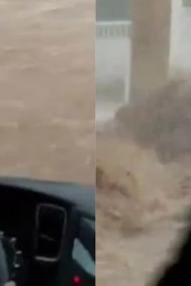 Cảnh nước lũ chảy cuồn cuộn trên phố, cuốn trôi cả ôtô tại Tây Ban Nha