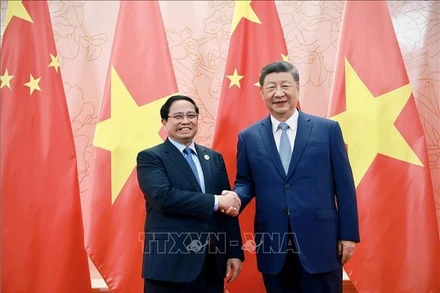 Thủ tướng Phạm Minh Chính hội kiến Tổng Bí thư, Chủ tịch nước Trung Quốc Tập Cận Bình. (Ảnh: TTXVN)