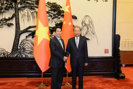 Chủ tịch nước Lương Cường hội kiến với Ủy viên trưởng Nhân đại toàn quốc Trung Quốc Triệu Lạc Tế.