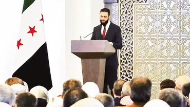 Tổng thống lâm thời Syria phát biểu tại hội nghị đối thoại quốc gia. 