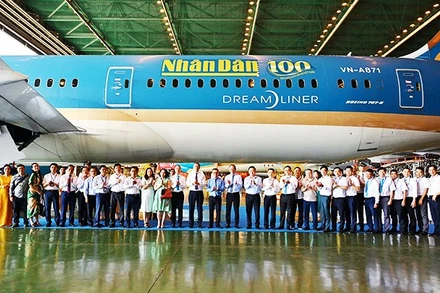 Ra mắt logo Báo Nhân Dân trên máy bay Vietnam Airlines