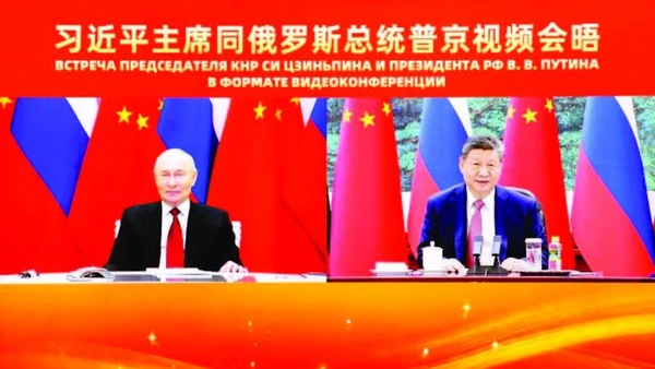 Hai nhà lãnh đạo Nga và Trung Quốc hội đàm trực tuyến. (Ảnh: TÂN HOA XÃ)