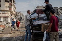 Người dân ở Gaza trở về nhà sau khi lệnh ngừng bắn có hiệu lực. (Ảnh WEF)