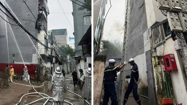 Lực lượng chức năng chữa cháy nhà trong ngách sâu ngõ hẹp. (Ảnh: Công an thành phố Hà Nội )