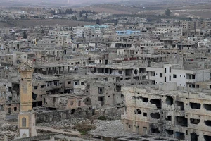 Những tòa nhà bị hư hại nặng nề do chiến sự tại Daraa, Syria. (Ảnh: THX/TTXVN)